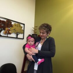 Dr. Nanette Santoro holds Beth Hunter's daughter, born through IVF after surgery for uterine fibroids | CU OB-GYN | Denver, CO