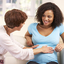 Pregnant woman talking to midwife | CU OB-GYN | Denver & Aurora, CO