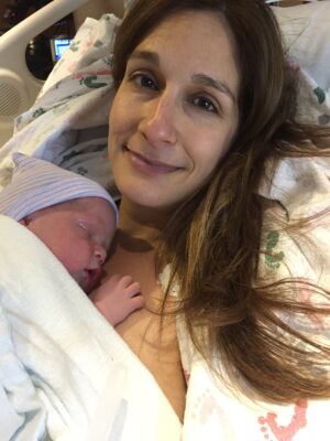 mom holds baby after successful sperm donation | CU OB-GYN