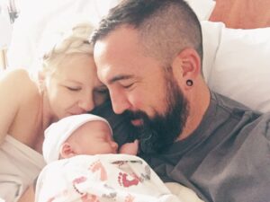 cancer survivor Jason with his wife Emily and their baby| CU OB-GYN | Denver, CO