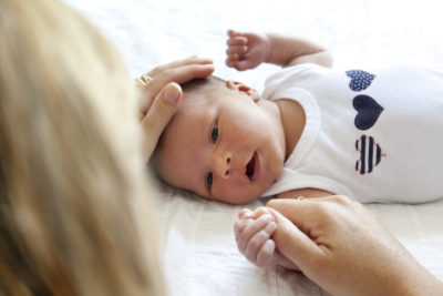 Newborn Screening | CU OB-GYN | Photo of mother caring for newborn