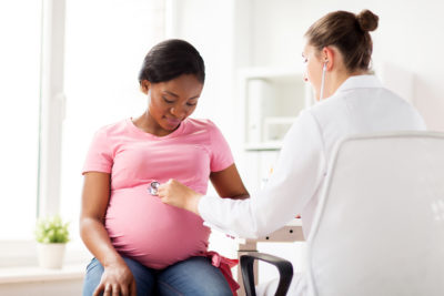 Pregnant Women and Flu Shots | CU OB-GYN | Pregnant woman at checkup
